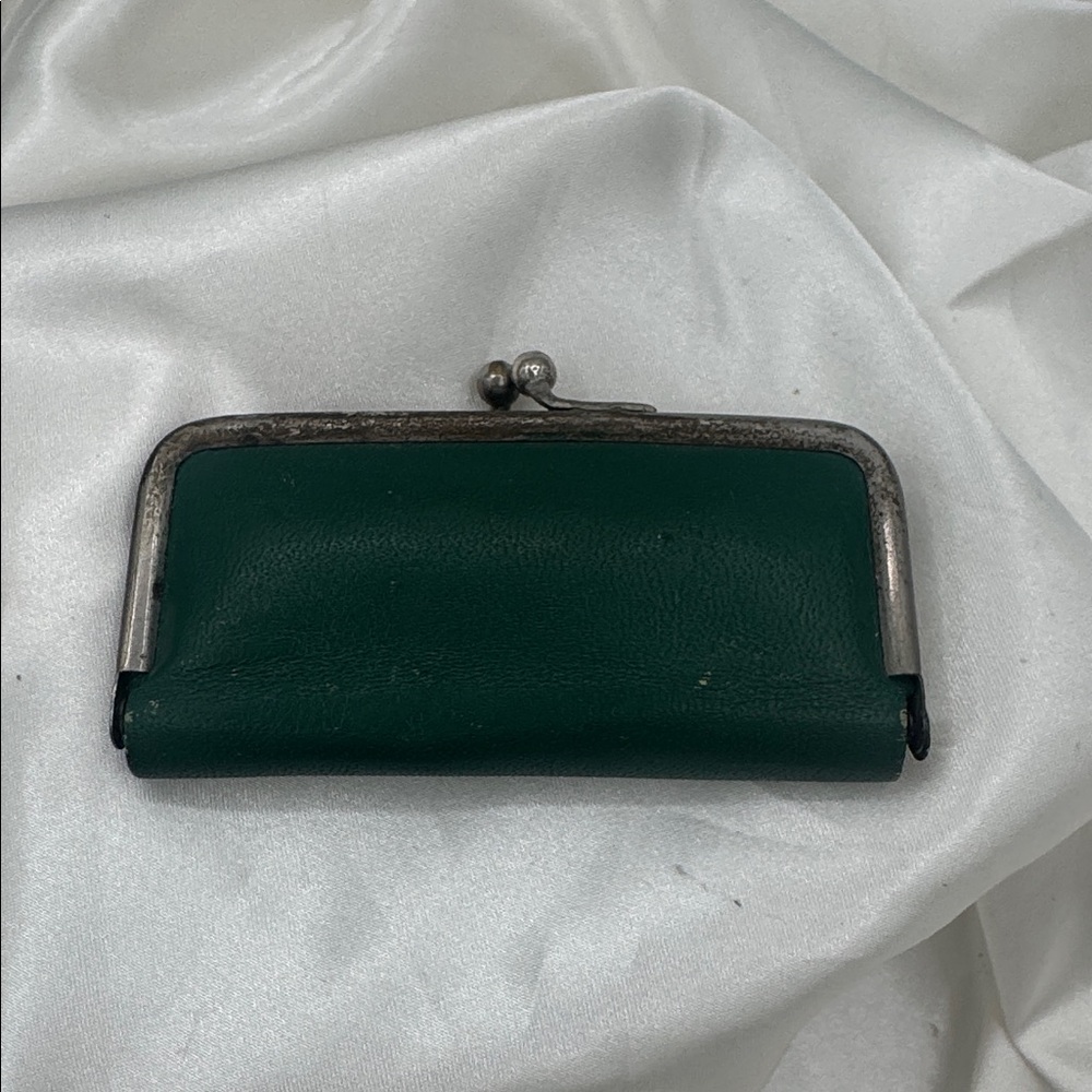 a vintage German manicure or hygiene set contained in a green leather case.